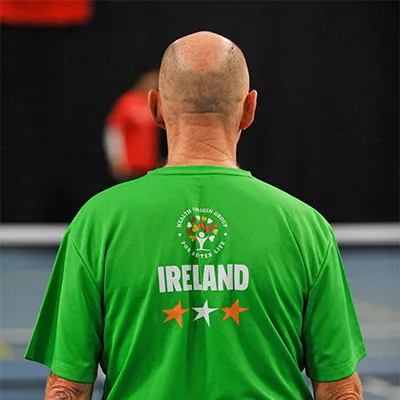 Team Ireland player stands on while his opponent in the European Federation Championships serves